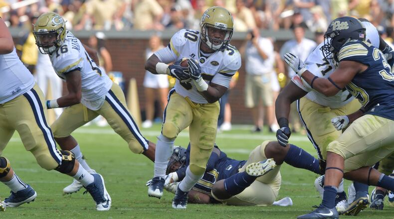 September 23, 2017 Atlanta - Georgia Tech running back KirVonte Benson (30) runs for a first down in the first half of an NCAA college football game at Bobby Dodd Stadium on Saturday, September 23, 2017. Georgia Tech won 35 - 17 over the Pittsburgh. HYOSUB SHIN / HSHIN@AJC.COM