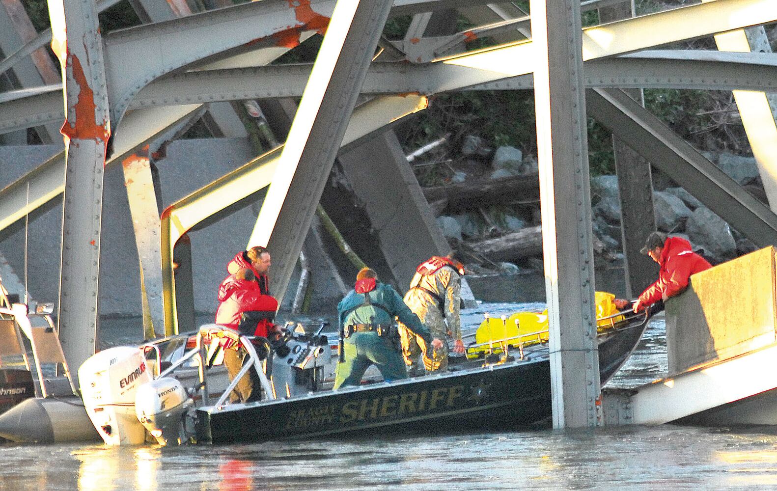 Vehicles, people dumped into water