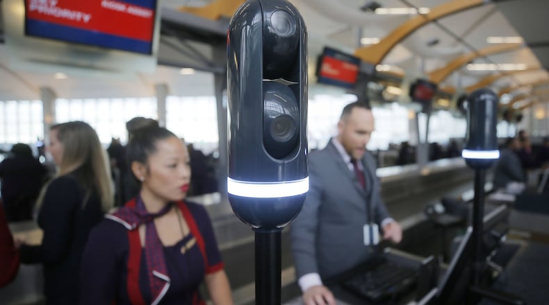 Cameras mounted on poles at the check-in counter scan travelers as they approach so the agent can have your flight info pulled up when you reach the counter. BOB ANDRES / BANDRES@AJC.COM
