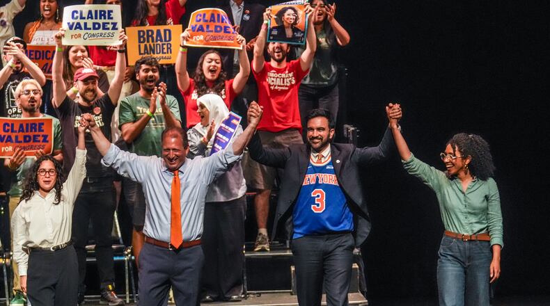 Democratic congressional candidates, Claire Valdez, Brad Lander, and Darializa Avila Chevalier gesture on stage with Mayor Zohran Mamdani during a Get Out The Vote rally ahead of New York's primary election, Thursday, June 18, 2026, in the Brooklyn borough of New York. (AP Photo/Ryan Murphy)