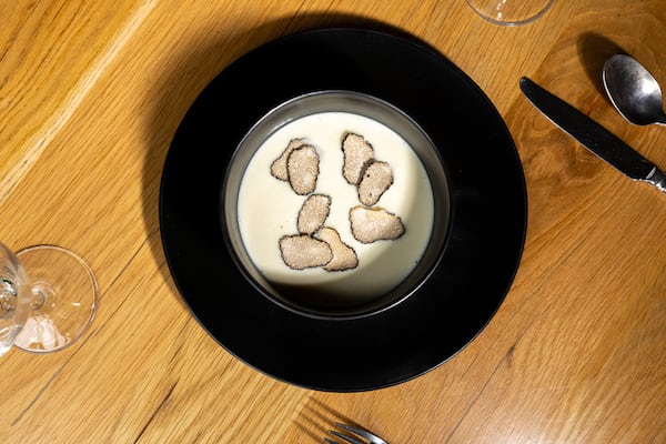 A celery root soup with black truffle and Parmigiano-Reggiano is among the menu offerings at Aria. (Arvin Temkar/AJC)