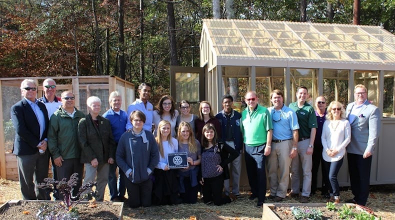 The greenhouse and raised garden beds at The Cottage School, built by Alpharetta Rotary Club members, will be used to teach students about topics such as composting, germination, planting and garden planning.