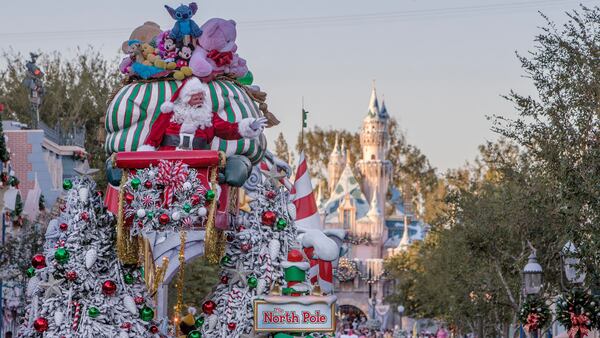 Santa Claus waves to Disneyland guests from his sleigh during the seasonal A Christmas Fantasy parade, performed daily at Disneyland Park. The joyful procession features a flurry of characters, music, and floats, bringing seasonal magic to the Happiest Place on Earth. Disneyland Resort is located in Anaheim, Calif.
