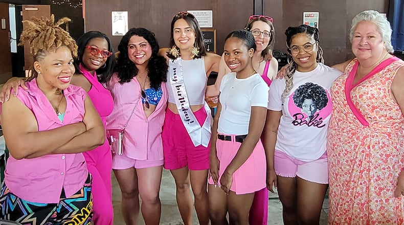 We all met working at the AJC, but we've remained friends for years. From left are: Stephanie Toone, Kimeko McCoy, Fiza Pirani, Ana Santos, Jewel Wickert, Courtney Martinez, Najja Parker and Nancy Clanton. (Courtesy of Nancy Clanton)
