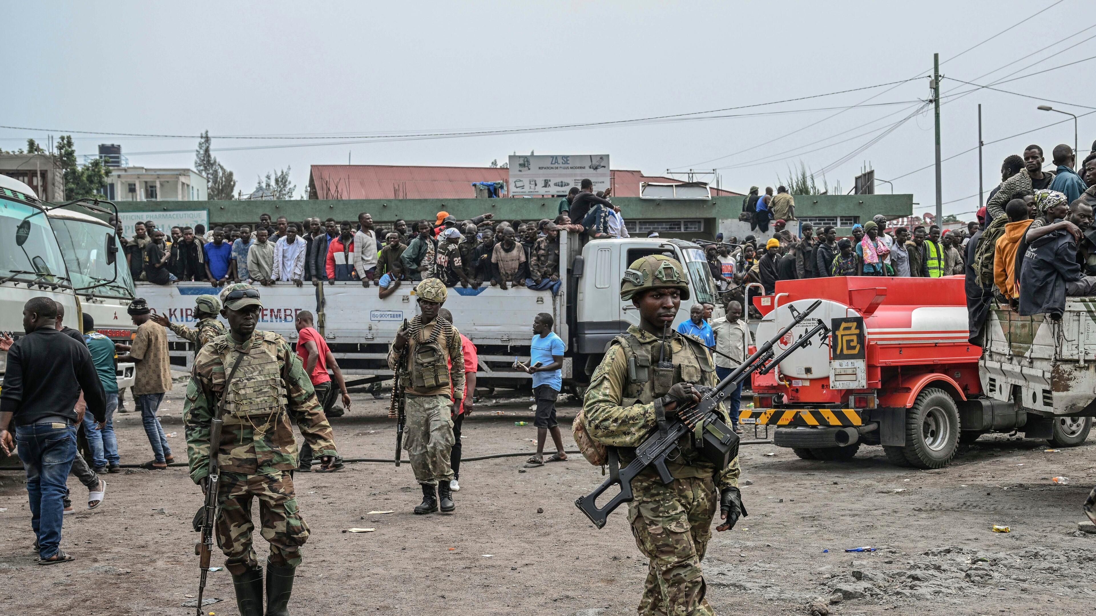 FILE - M23 rebels escort government soldiers and police who surrendered to an undisclosed location in Goma, Democratic republic of the Congo, Jan. 30, 2025. (AP Photo/Moses Sawasawa, File)