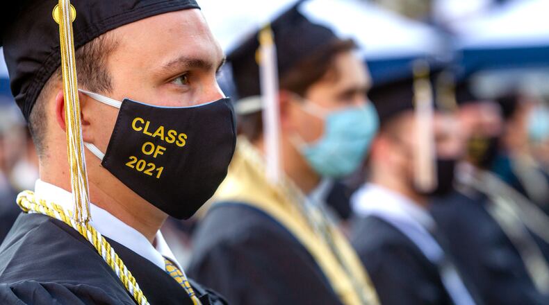 Graduates listen to the speakers during the 2021 commencement ceremony at Bobby Dodd Stadium on Saturday, May 8, 2021. Two ceremonies were held Saturday for bachelor’s degree recipients, and master's and doctoral graduates' ceremonies were held Friday. (Photo: Steve Schaefer for The Atlanta Journal-Constitution)