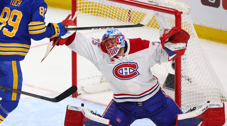 Montreal Canadiens goaltender Jakub Dobes makes a save during the third period in Game 5 of a second-round NHL hockey Stanley Cup playoff series against the Buffalo Sabres, Thursday, May 14, 2026, in Buffalo, N.Y. (AP Photo/Jeffrey T. Barnes)