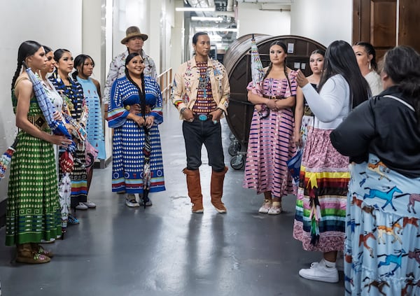 Models prepare to take the runway for the 2025 Native Fashion Show, Friday, May 9, 2025, in Santa Fe, N.M. (AP Photo/Roberto E. Rosales)