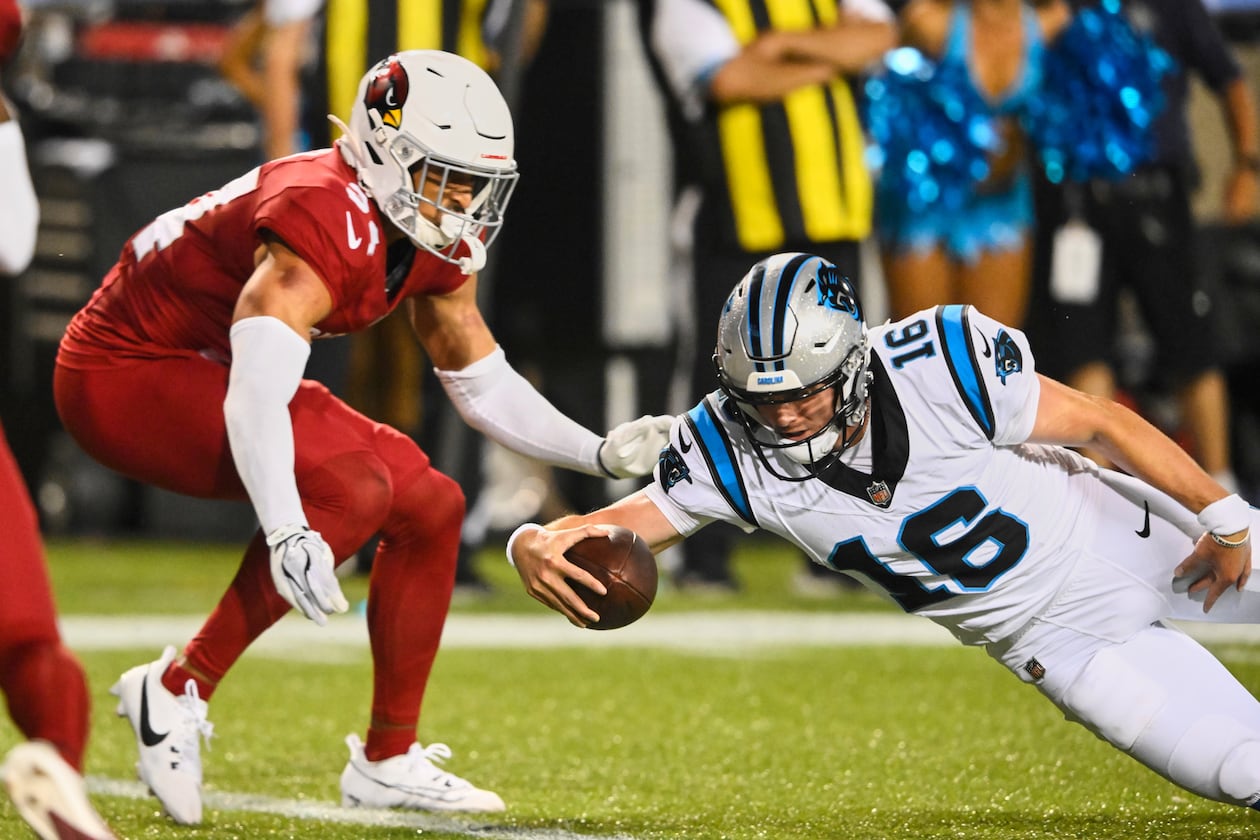 Carolina Panthers quarterback Haynes King (16) dives into the endzone next to Arizona Cardinals safety Isaiah Oliver, left, to win the game on the last play of the game in the second half of the Pro Football Hall of Fame NFL preseason game in Canton, Ohio, Thursday, Aug. 6, 2026. (AP Photo/David Richard)