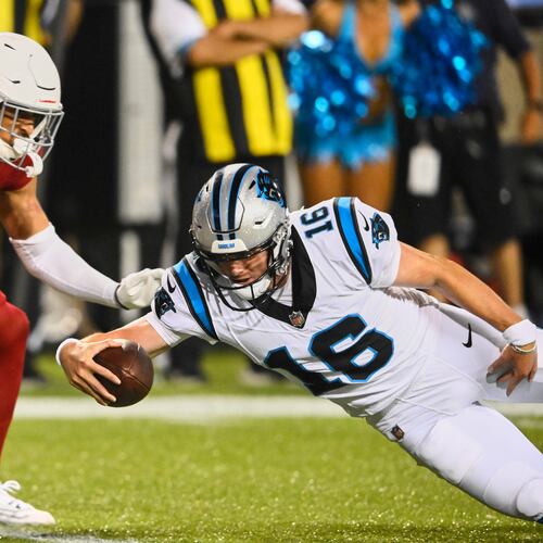 Carolina Panthers quarterback Haynes King (16) dives into the endzone next to Arizona Cardinals safety Isaiah Oliver, left, to win the game on the last play of the game in the second half of the Pro Football Hall of Fame NFL preseason game in Canton, Ohio, Thursday, Aug. 6, 2026. (AP Photo/David Richard)