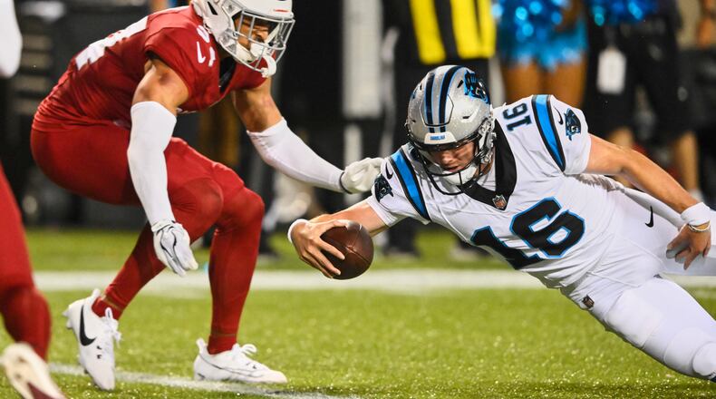 Carolina Panthers quarterback Haynes King (16) dives into the endzone next to Arizona Cardinals safety Isaiah Oliver, left, to win the game on the last play of the game in the second half of the Pro Football Hall of Fame NFL preseason game in Canton, Ohio, Thursday, Aug. 6, 2026. (AP Photo/David Richard)