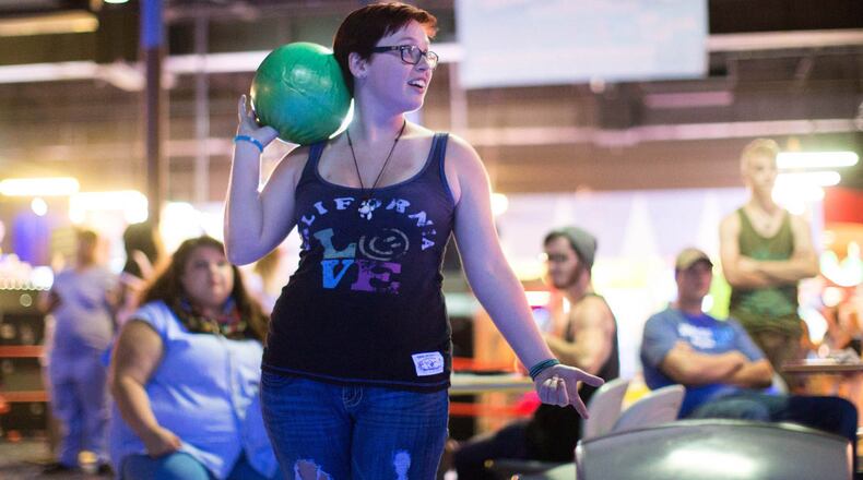 Heather Black, who works at Steak 'n Shake, waits her turn to bowl at Stars and Strikes on Service Industry Night. People who work in the service industry bowl for free every Monday night.