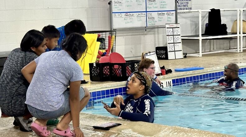 Marcela Cruz-Baltazar and her three kids at the Oakhurst Pool on August 4, 2024. (Photo Courtesy of Daniela Cintron)