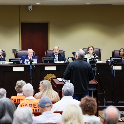 Board members listen to a speaker during a State Election Board meeting at Dawson County Government Center on Wednesday, April 15, 2026. (Miguel Martinez/AJC)