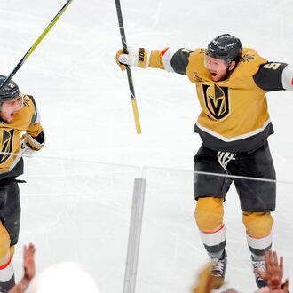 Vegas Golden Knights center Brett Howden, left, celebrates with Vegas Golden Knights defenseman Jeremy Lauzon (5) after scoring against the Utah Mammoth during second overtime of Game 5 in a first-round NHL hockey Stanley Cup playoff series Wednesday, April 29, 2026, in Las Vegas. (Steve Marcus/Las Vegas Sun via AP)