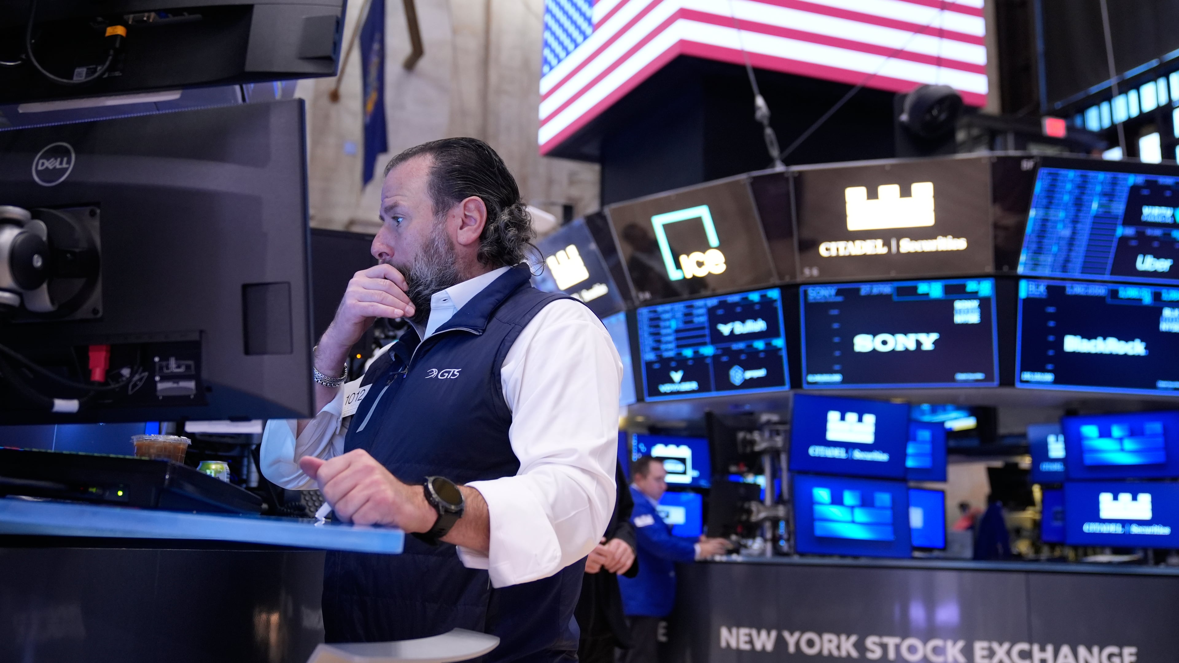 Michael Pistillo works on the floor at the New York Stock Exchange in New York, Tuesday, Nov. 11, 2025. (AP Photo/Seth Wenig)