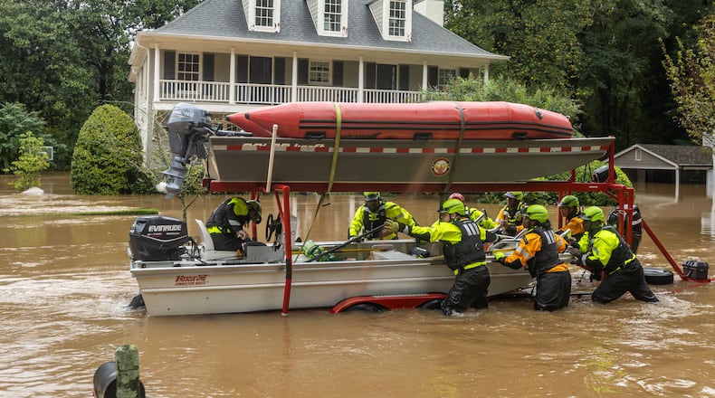 Atlanta Fire Rescue’s swift-water dive team performed welfare checks on residents on Hanover West Drive in Atlanta on Friday, Sept. 27, 2024, after Hurricane Helene caused major flooding in parts of Atlanta. (John Spink/AJC)