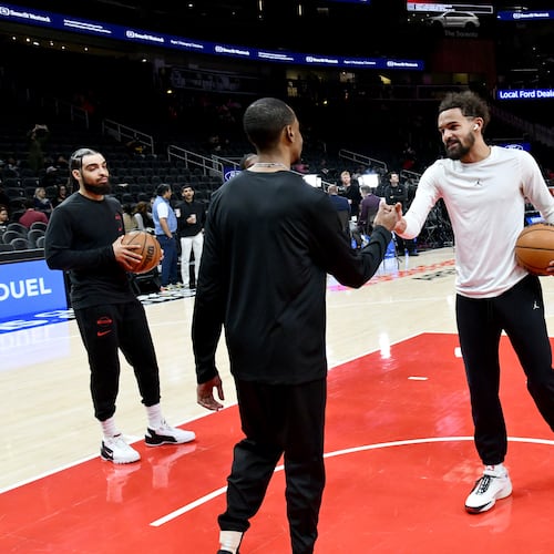 Atlanta Hawks guard Trae Young greets a floor staff member as he appears before an NBA basketball game against New Orleans Pelicans at State Farm Arena, Wednesday, Jan. 7, 2026, in Atlanta. Young, the four-time All-Star guard, has played in just 10 games for the Hawks this season and after not getting a contract extension in the offseason, his days with the Hawks seem to be numbered. (Hyosub Shin/AJC)
