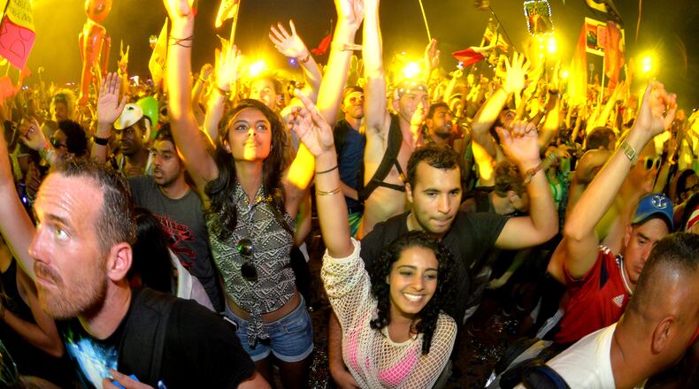 A crowd dances to electronic beats at the TomorrowWorld electronic music festival in Chattahoochee Hills, South of Atlanta, on Saturday, Sept. 27, 2014. HYOSUB SHIN / HSHIN@AJC.COM