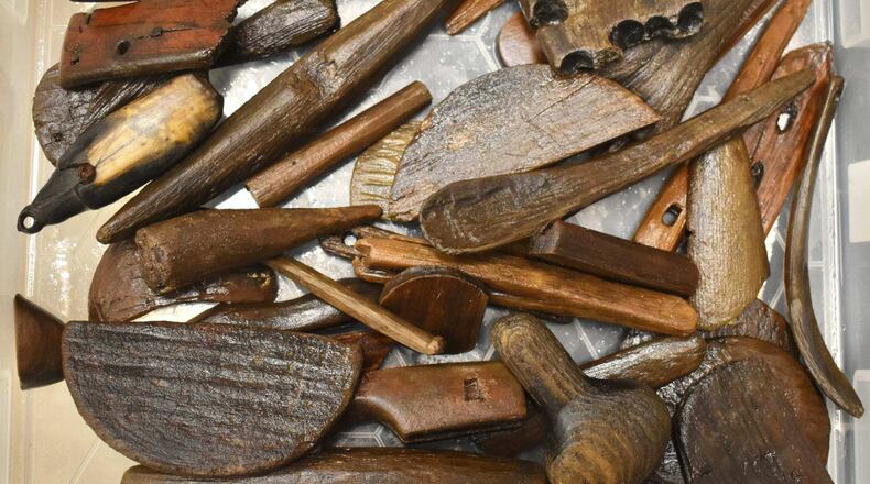 This photo provided by Richard Arden Knecht shows various tools, utensils and other artifacts that were recovered after the Typhoon Halong scattered them from a significant Yup'ik archaeological site, known as the Nunalleq site, in Quinhagak, Alaska, Oct. 2025. (Richard Arden Knecht via AP)