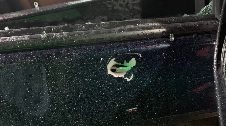 Brown's window was shattered by a bullet and her car door was damaged.