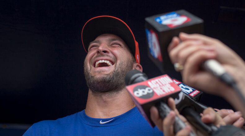 Tim Tebow answers questions for the media during a press conference at Steinbrenner Field. ( Charlie Kaijo/Tampa Bay Times/ZUMA Wire/TNS)