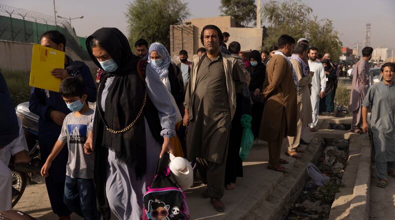 People trying to flee the country gather outside of the international airport in Kabul, Afghanistan, on Thursday, Aug. 19, 2021. A sluggish State Department response to the Taliban’s rapid takeover of Kabul, Afghanistan’s capital, has stranded thousands of Afghans who helped the United States and are now clamoring to be evacuated as they wait for their immigration visas to be approved, two U.S. officials said. (Victor J. Blue/The New York Times)