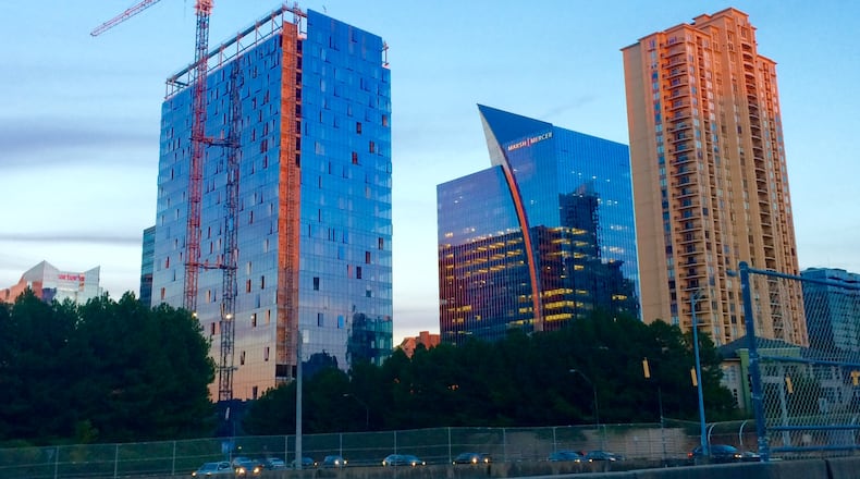 Three Alliance Center, left, is one of the region’s newest speculative office towers. Global Payments, a major payments processor, plans to take space in the building for its new corporate headquarters. J. Scott Trubey/strubey@ajc.com