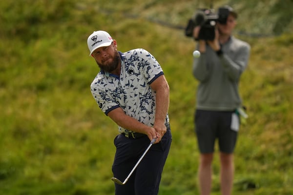 Tyrrell Hatton of England chips onto the 7th green during the second round of the British Open golf championship at the Royal Portrush Golf Club, Northern Ireland, Friday, July 18, 2025. (AP Photo/Francisco Seco)