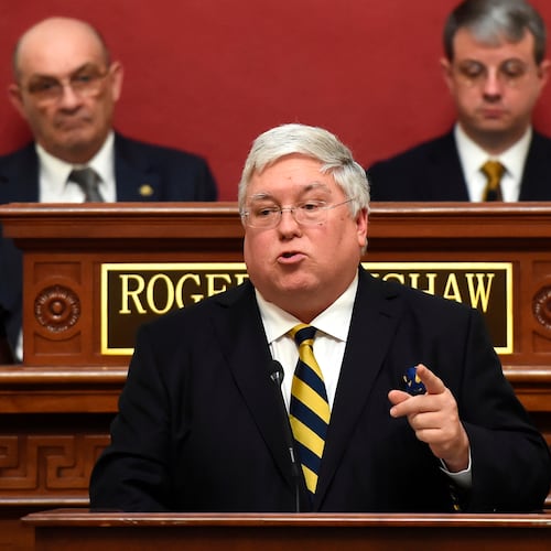 FILE - West Virginia Gov. Patrick Morrisey, center, gives his first State of the State in the House of Delegates chamber at the Capitol in Charleston, W.Va., Feb. 12, 2025. (Chris Dorst/Charleston Gazette-Mail via AP, file)
