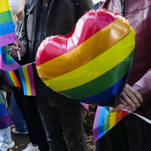 People gather outside a high court before its ruling on same-sex marriage in Tokyo, Friday, Nov. 28, 2025. (Miki Matsuzaki/Kyodo News via AP)