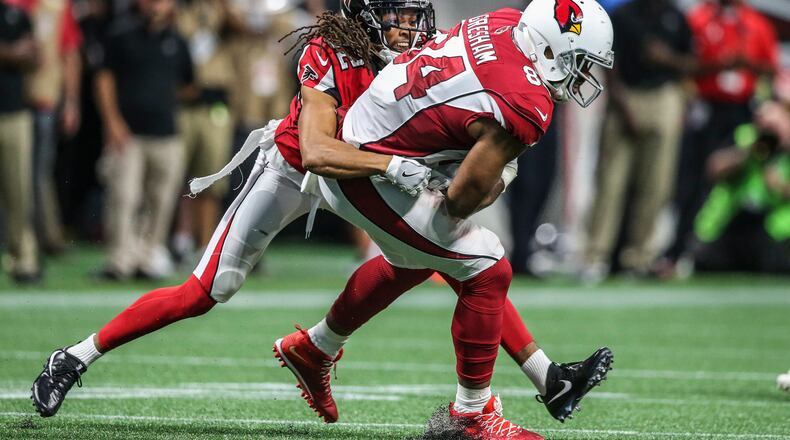 August 26, 2017 Atlanta: Atlanta Falcons cornerback Jalen Collins (32) (left) snags Arizona Cardinals tight end Jermaine Gresham (84) during 2nd quarter action on Saturday, Aug. 26, 2017 at the opening of the brand new Mercedes Benz Stadium and pre-season NFL game between the Atlanta Falcons and the Arizona Cardinals. JOHN SPINK/JSPINK@AJC.COM