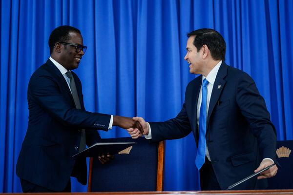 U.S. Secretary of State Marco Rubio and Guyanese Foreign Minister Hugh Todd shake hands as they sign Security Memorandum of Understanding, in Georgetown, Guyana, Thursday, March 27, 2025. (Nathan Howard/Pool photo via AP)