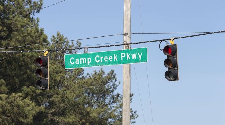 A Camp Creek Parkway sign hangs at the intersection of Interstate 285 in East Point, Friday, December 29, 2017. ALYSSA POINTER/ALYSSA.POINTER@AJC.COM