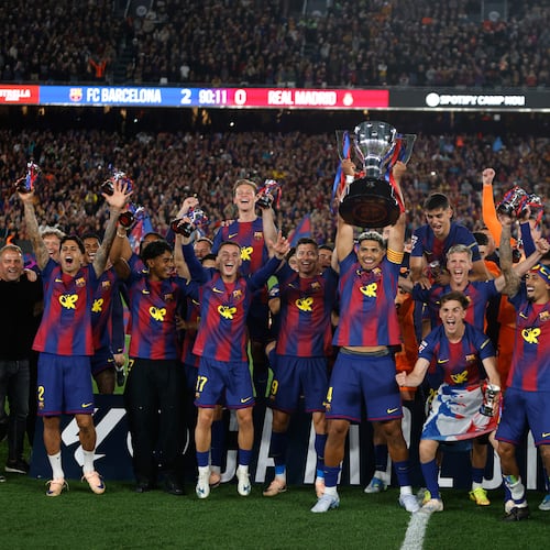 Barcelona players lift the trophy after winning the Spanish La Liga soccer match against Real Madrid to clinch the Spanish league title in Barcelona, Spain, Sunday, May 10, 2026. (AP Photo/Joan Monfort)