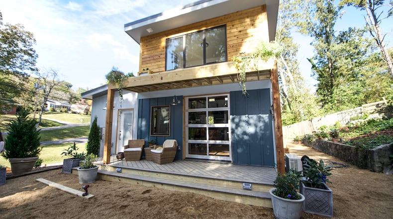 A two-story tiny house built by Wind River Tiny Homes.