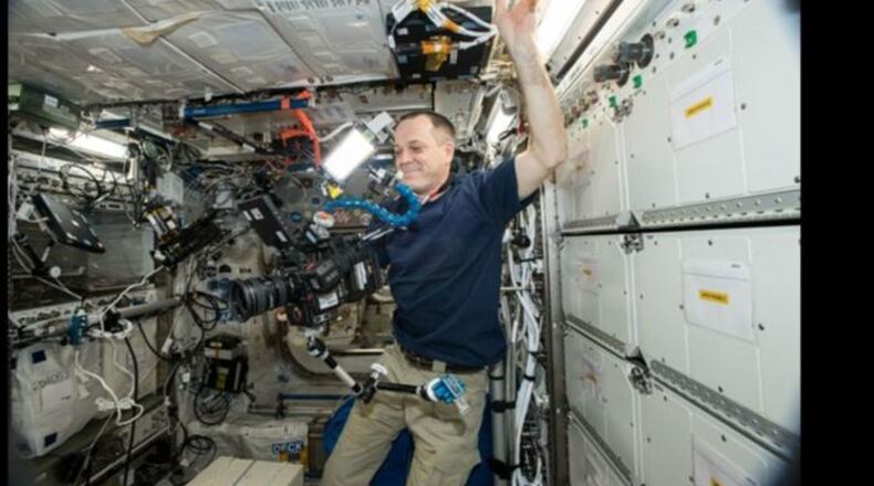Astronaut Ricky Arnold uses the new 8K camera as he works aboard the International Space Station.