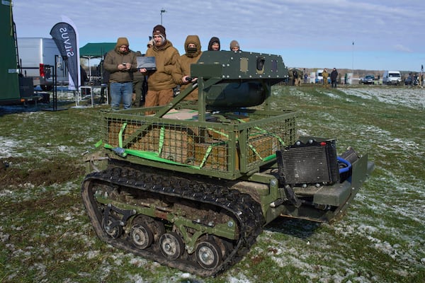 FILE - A manufacturer demonstrates a Ukrainian made unmanned ground vehicle at a Ukraine Defense Innovations exhibition for military clients on an undisclosed location in Ukraine, Friday, April 11, 2025. (AP Photo/Efrem Lukatsky, File)