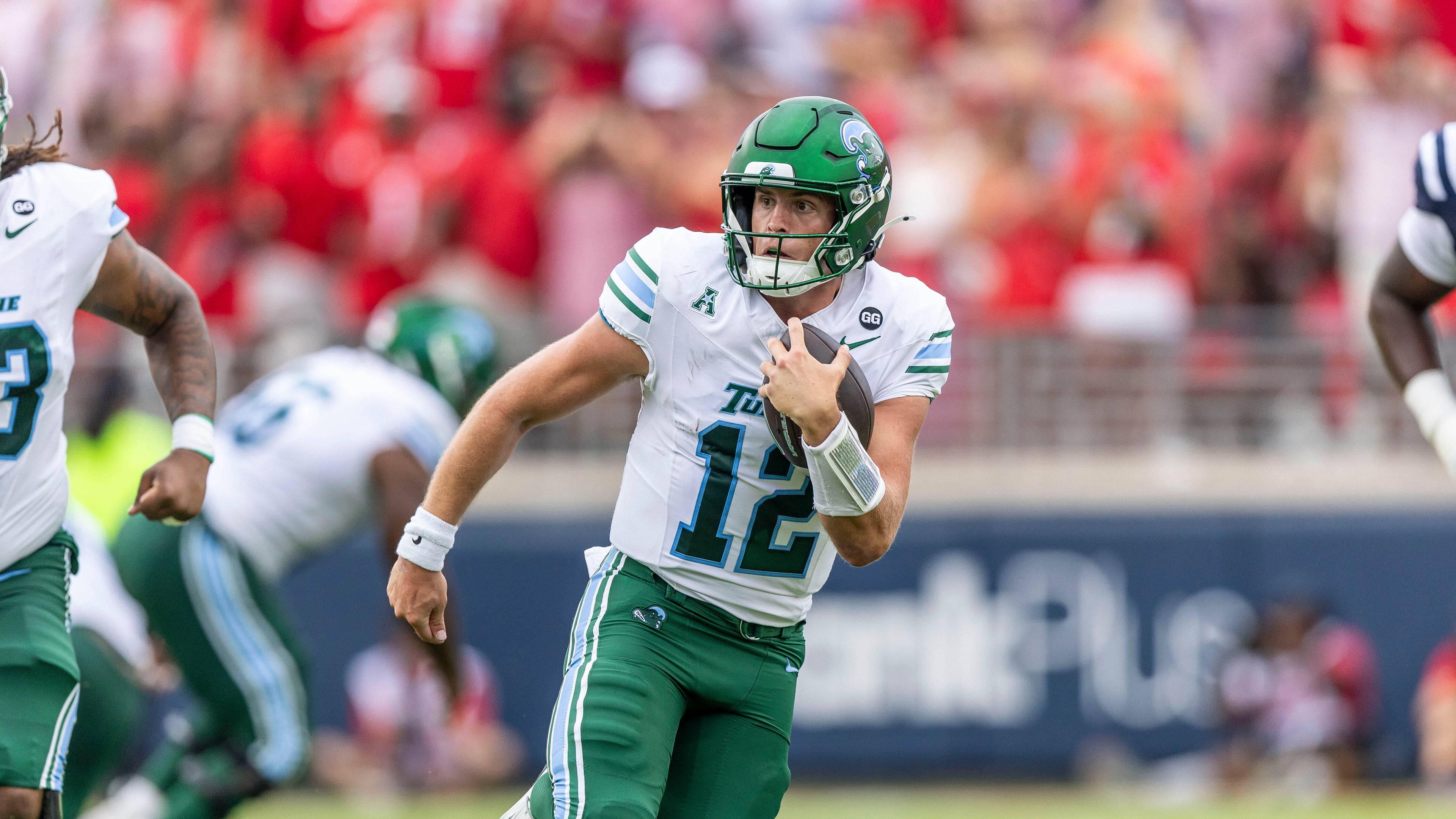 FILE - Tulane quarterback Jake Retzlaff (12) runs the ball against Mississippi during the first half of an NCAA football game on Saturday, Sept. 20, 2025, in Oxford, Miss. (AP Photo/Vasha Hunt, File)