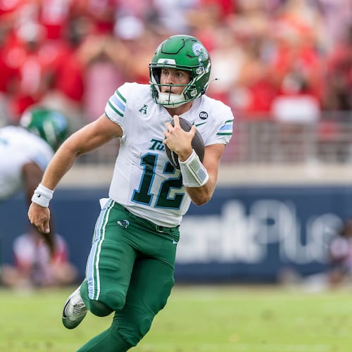 FILE - Tulane quarterback Jake Retzlaff (12) runs the ball against Mississippi during the first half of an NCAA football game on Saturday, Sept. 20, 2025, in Oxford, Miss. (AP Photo/Vasha Hunt, File)
