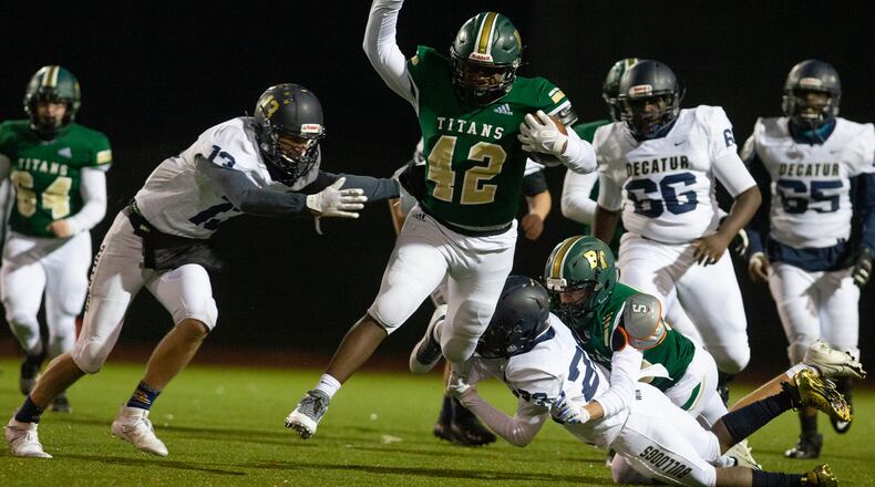 Blessed Trinity with the big win: Deldrick Franklin (42) runs through the Decatur defense during a play in Friday's 44-0 state playoff victory in Roswell.