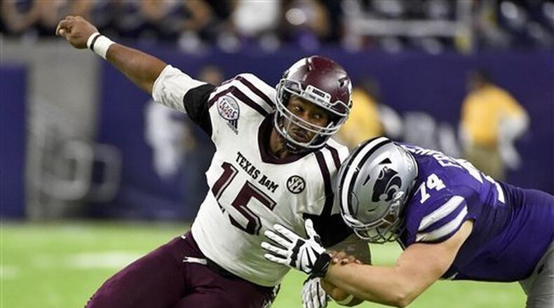 In this Dec. 28, 2016, file photo, Texas A&M’s Myles Garrett (15) tries to get around Kansas State offensive lineman Scott Frantz during the second half of the Texas Bowl NCAA college football game in Houston.The NFL Draft will be held April 27-29, 2017, in Philadelphia. (AP Photo/Eric Christian Smith, File)