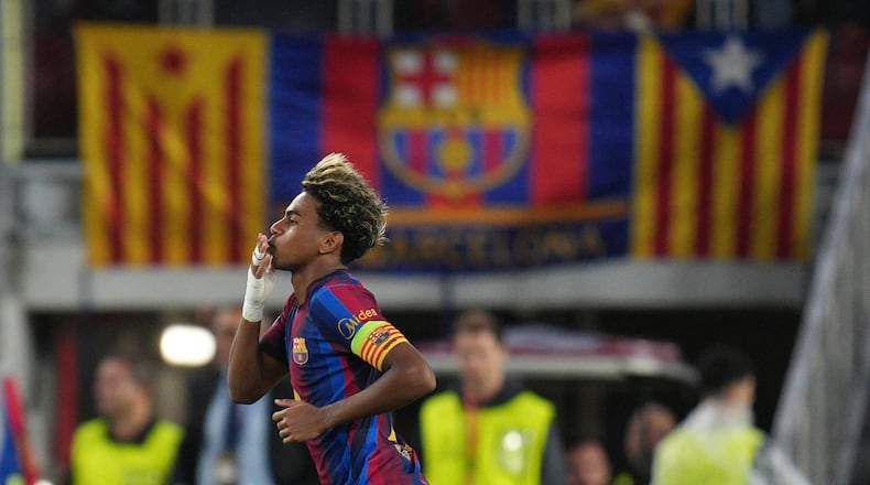 Barcelona's Lamine Yamal celebrates after scoring his side's fourth goal during the Champions League opening phase soccer between Barcelona and Feyenoord in Barcelona, Spain, Wednesday, Sept. 9, 2026.(AP Photo/Emilio Morenatti)