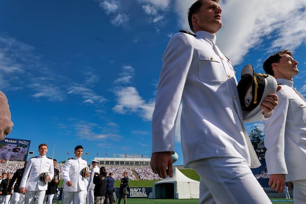 Members of the class of 2025 enter the U.S. Naval Academy for the academy's graduation and commissioning ceremony in Annapolis, Md.,Friday, May 23, 2025. (AP Photo/KT Kanazawich)