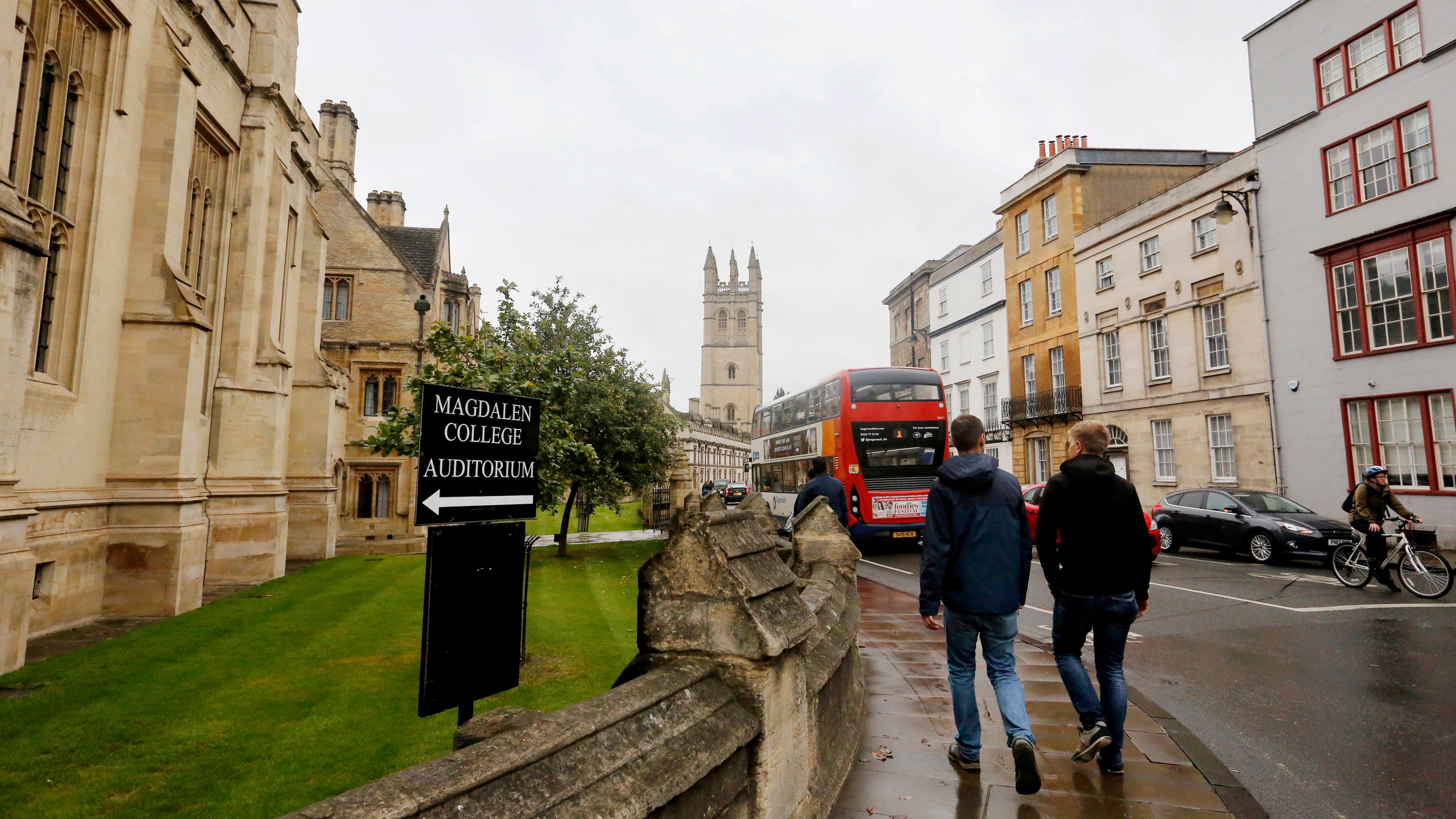 FILE - People walk around Oxford University's campus on Sept. 3, 2017, in Oxford, England. (AP Photo/Caroline Spiezio, File)