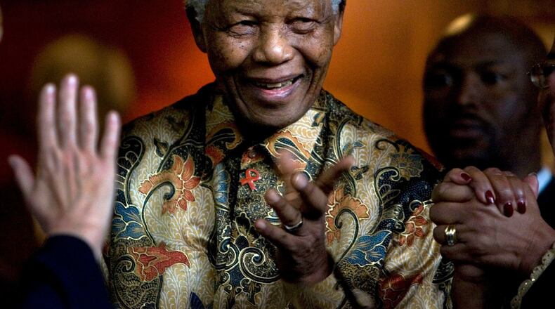 Former South African President Nelson Mandela reacts after a meeting at the Nelson Mandela Foundation building in Johannesburg, South Africa in 2007.