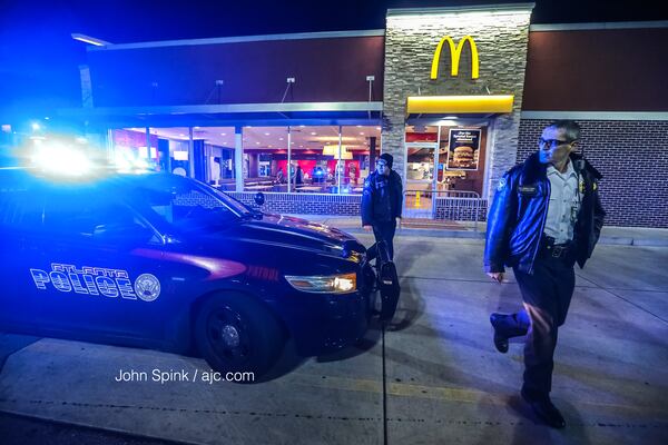 Authorities are investigating after an armed robber climbed through a northeast Atlanta McDonald’s drive-thru window and took cash. JOHN SPINK / JSPINK@AJC.COM