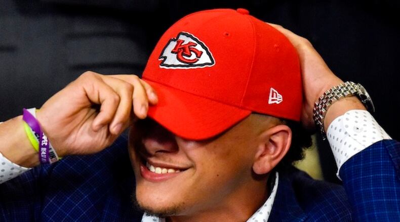 Patrick Mahomes II smiles as he puts on a Kansas City Chiefs hat for the first time during an NFL Draft watch party at Lago del Pino in Tyler, Texas, on Thursday, April 27, 2017. Mahomes II was the tenth overall pick in the first round of the NFL draft for the Kansas City Chiefs after a trade with the Buffalo Bills. (Chelsea Purgahn/Tyler Morning Telegraph)