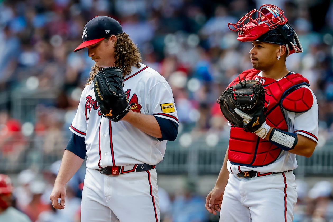 Atlanta Braves catcher Drake Baldwin (right) meets with pitcher Grant Holmes (left) during the second inning of a baseball game against the Philadelphia Phillies, Sunday, Sept. 13, 2026, in Atlanta. (Erik S. Lesser/AP)
