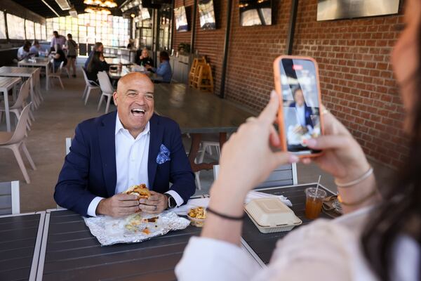 Steak Shapiro records a sandwich review called, “Steak Tips,” on his social media with Becca Mamane, digital marketing associate for Bread n Butter Content Studio. (Jason Getz / jason.getz@ajc.com)